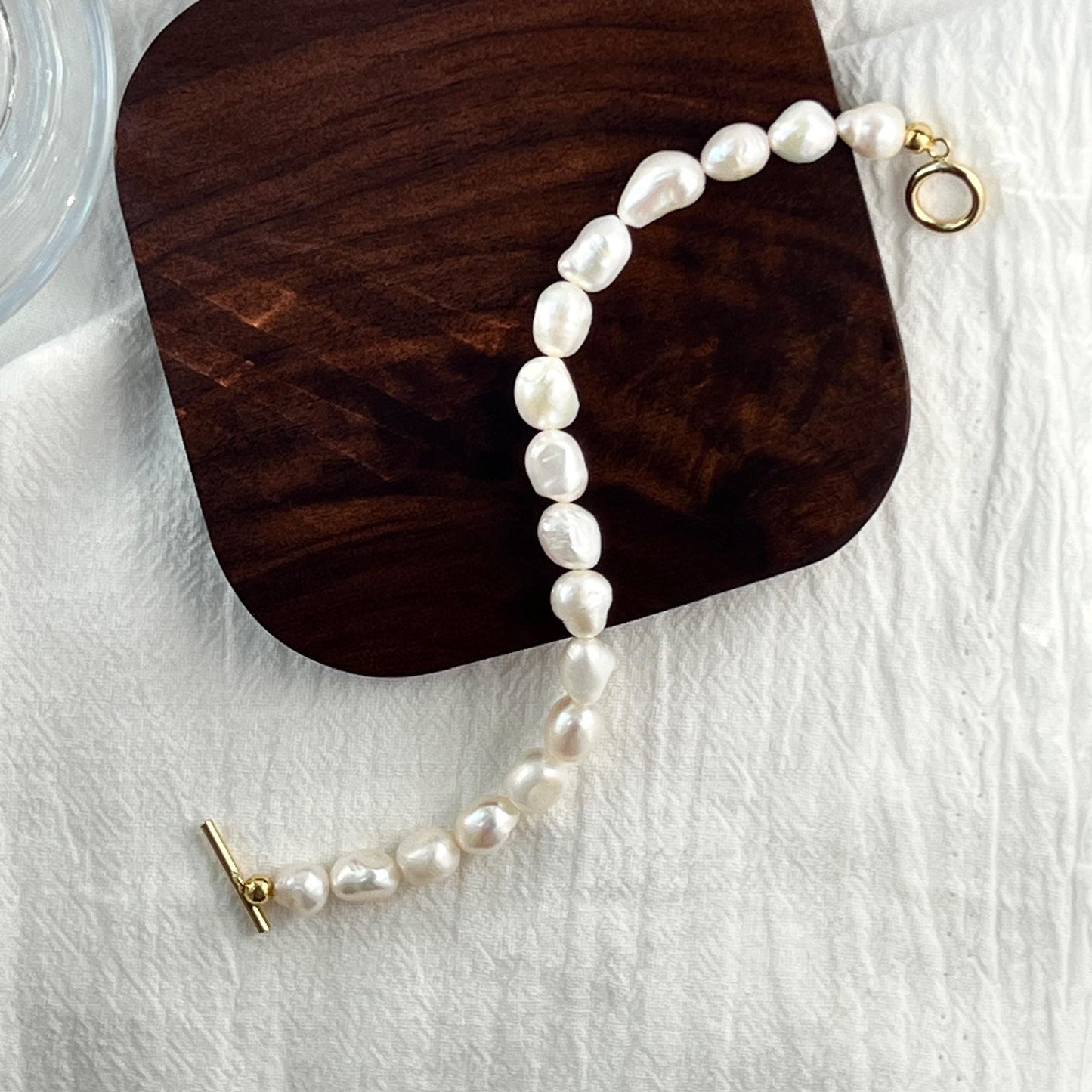 14K gold-filled baroque pearl bracelet shown from multiple angles, minimalist and elegant design