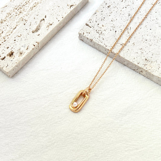 Front view of 18K gold bar necklace with delicate freshwater pearl