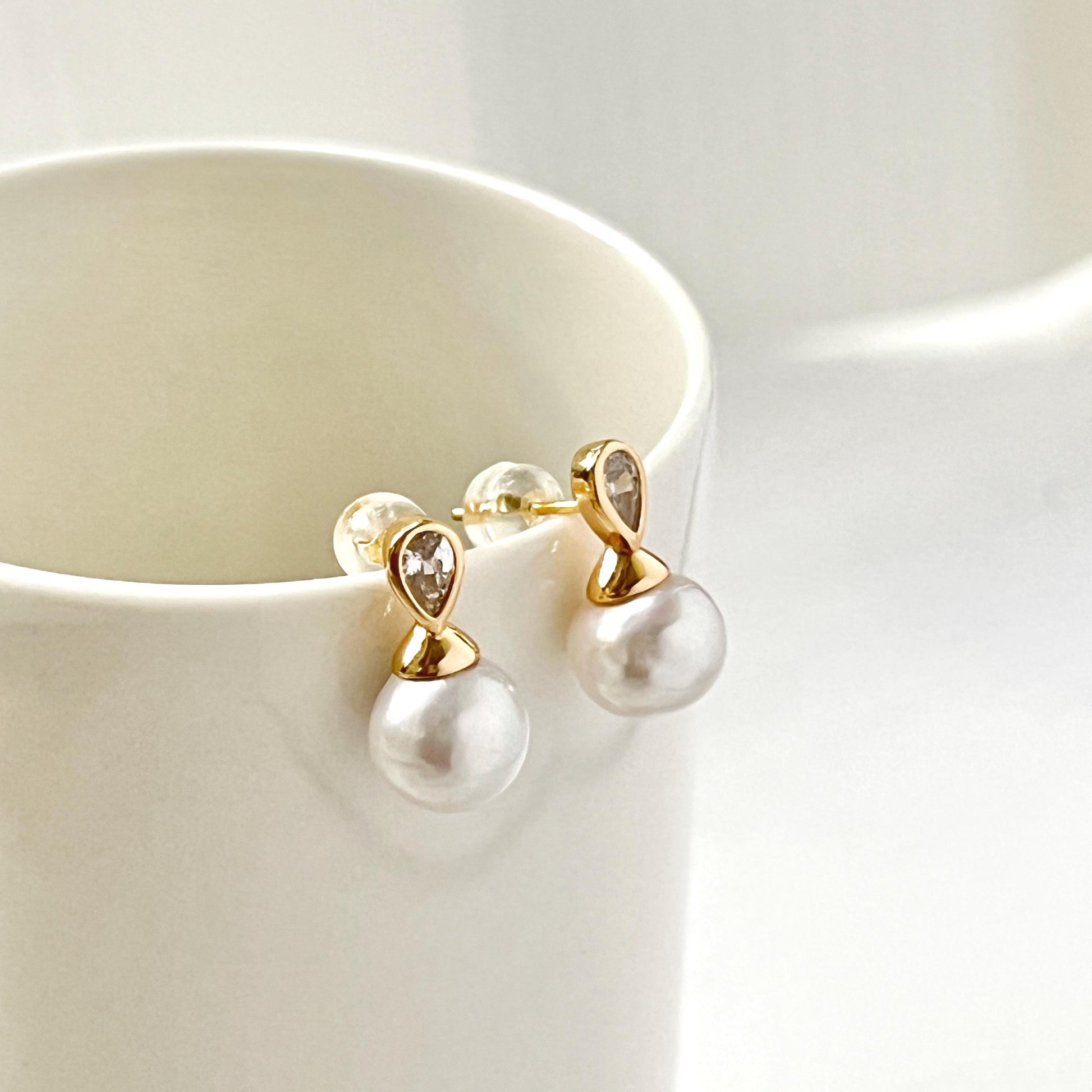 Woman wearing 18K gold baroque freshwater pearl & crystal stud earrings, perfect for weddings or bridesmaids