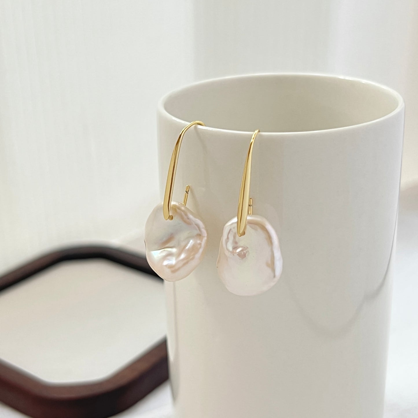 Close-up of baroque pearl and gold petal detail