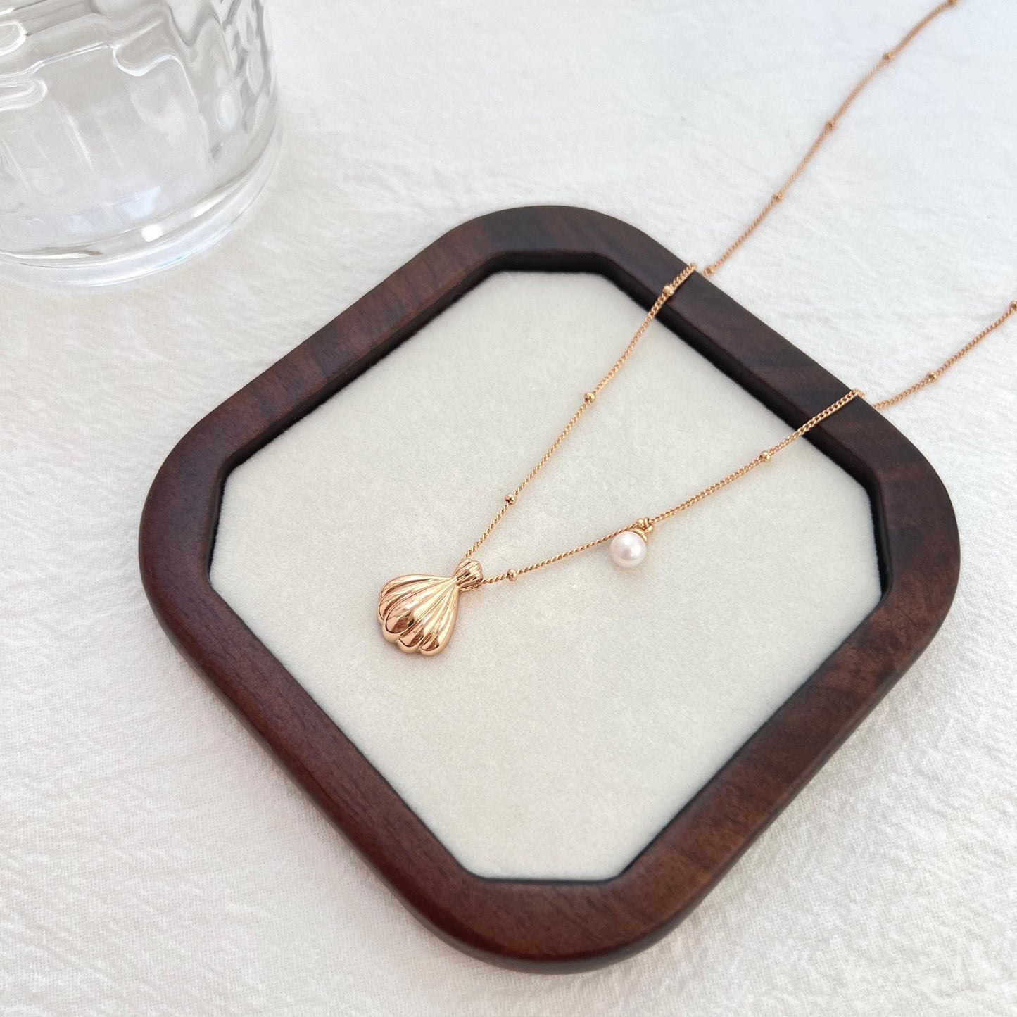 18K gold shell freshwater pearl charm necklace presented in eco-friendly gift box