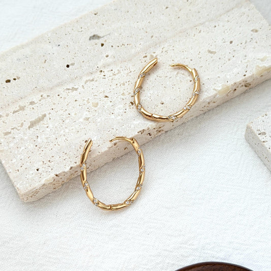 18k gold twisted rope hoop earrings with cz on ear everyday chic accessory