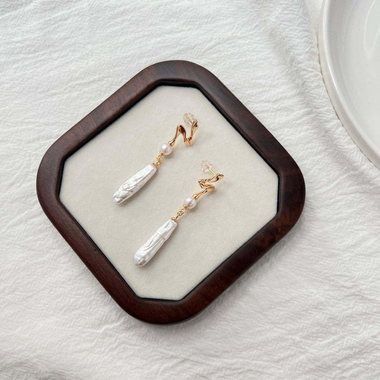 Ocealine Jewelry branding image featuring 18K gold baroque pearl bar drop earrings