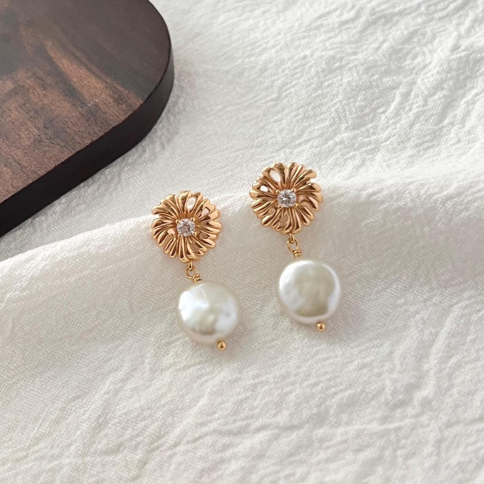 Ocealine Jewelry branding image featuring 18K gold baroque pearl and zircon earrings