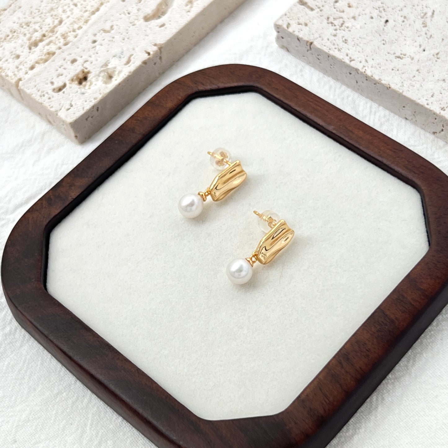 Side view of 18K gold freshwater pearl drop earrings