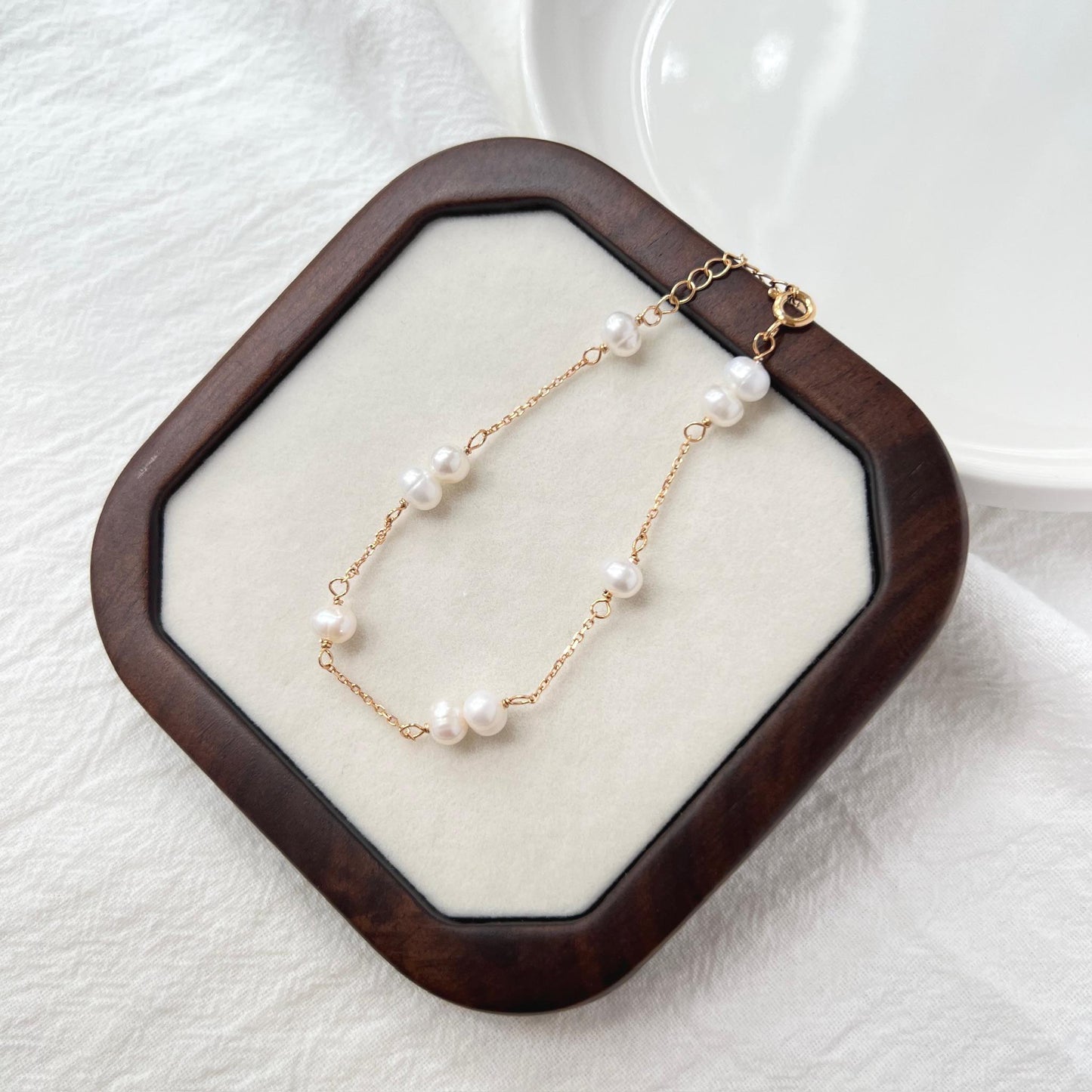 Close-up of 18K gold baroque freshwater pearl beaded bracelet showing bead and pearl detail