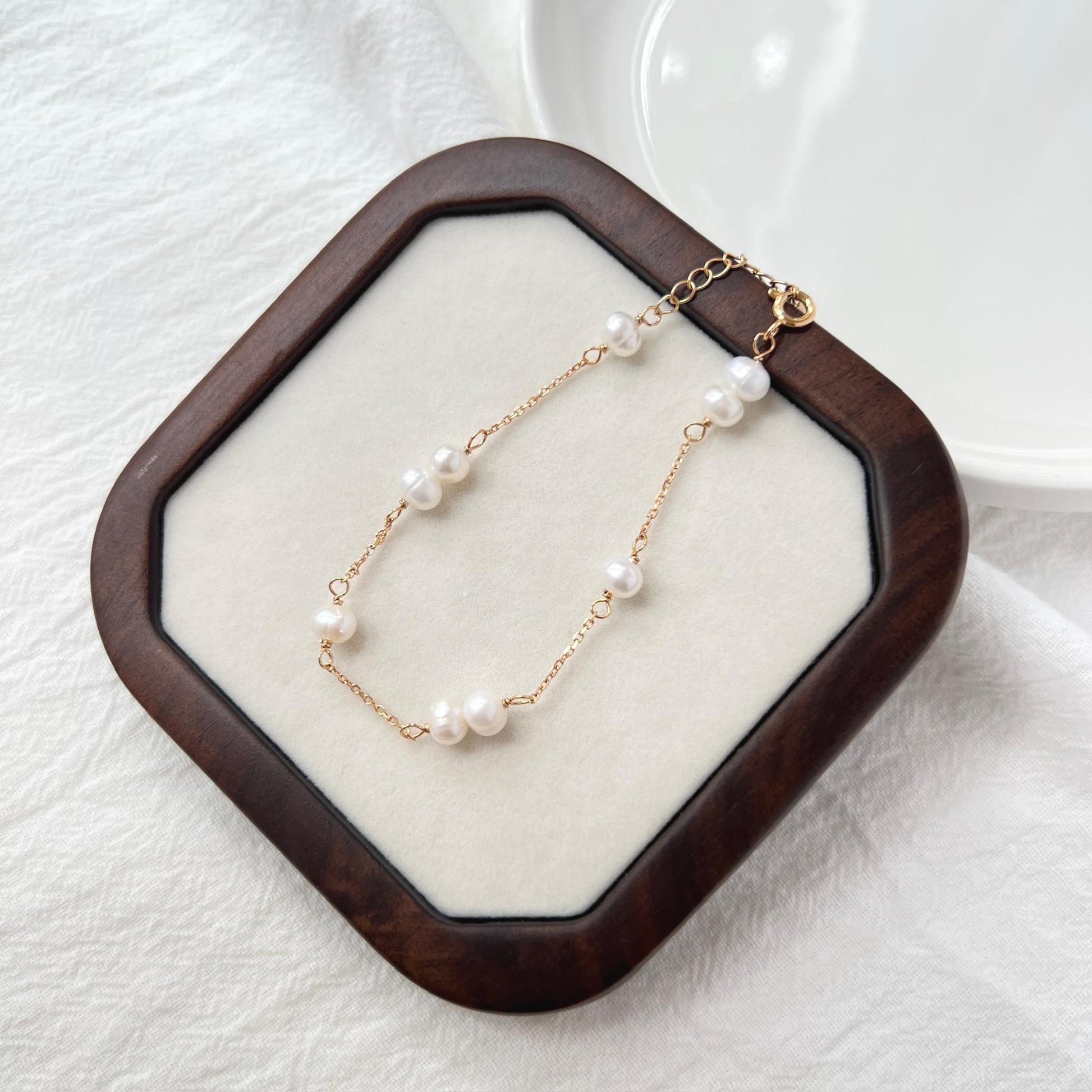Close-up of 18K gold baroque freshwater pearl beaded bracelet showing bead and pearl detail