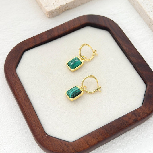 Green malachite hoop earrings with rectangular stone pendants and textured gold hoop design