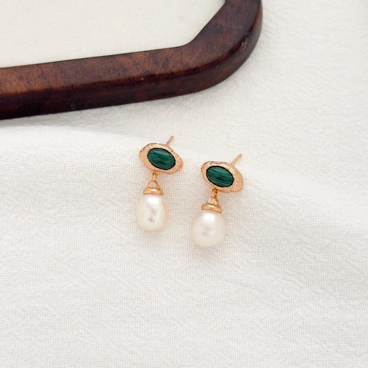 Vintage malachite pearl earrings with textured gold setting and luminous pearl drop design