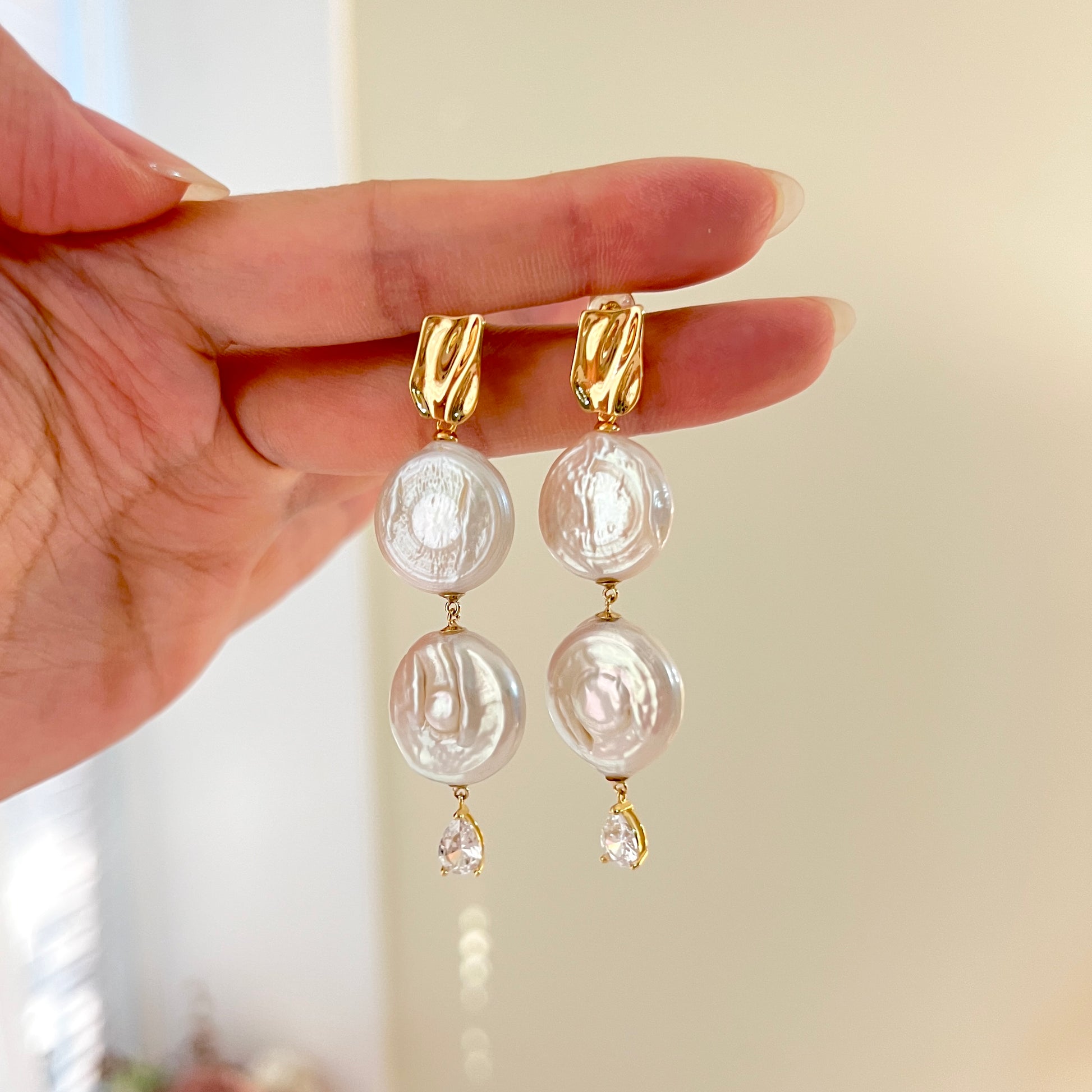 Rome Coin pearl drop dangle earrings shown from multiple angles, elegant and minimalist design