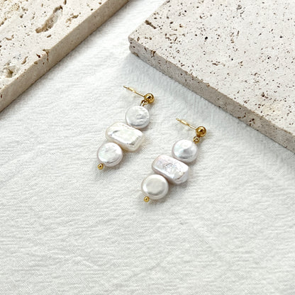 Side view of 14K gold baroque pearl coin rectangle earrings showing natural pearl luster