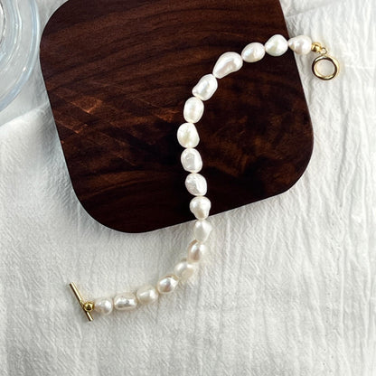 14K gold-filled baroque pearl bracelet shown from multiple angles, minimalist and elegant design