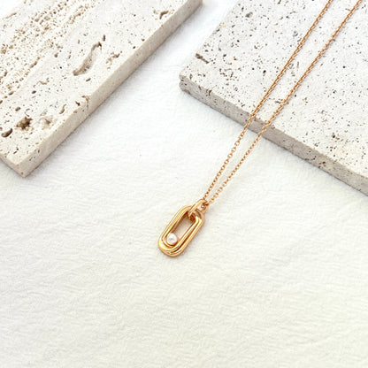 Front view of 18K gold bar necklace with delicate freshwater pearl