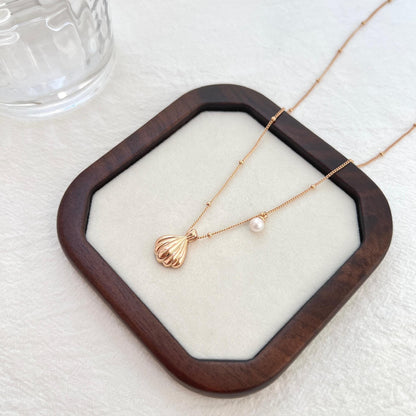 18K gold shell freshwater pearl charm necklace presented in eco-friendly gift box