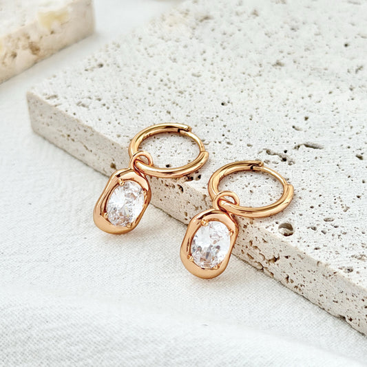18k gold cz oval huggie hoop earrings on ear everyday chic jewelry
