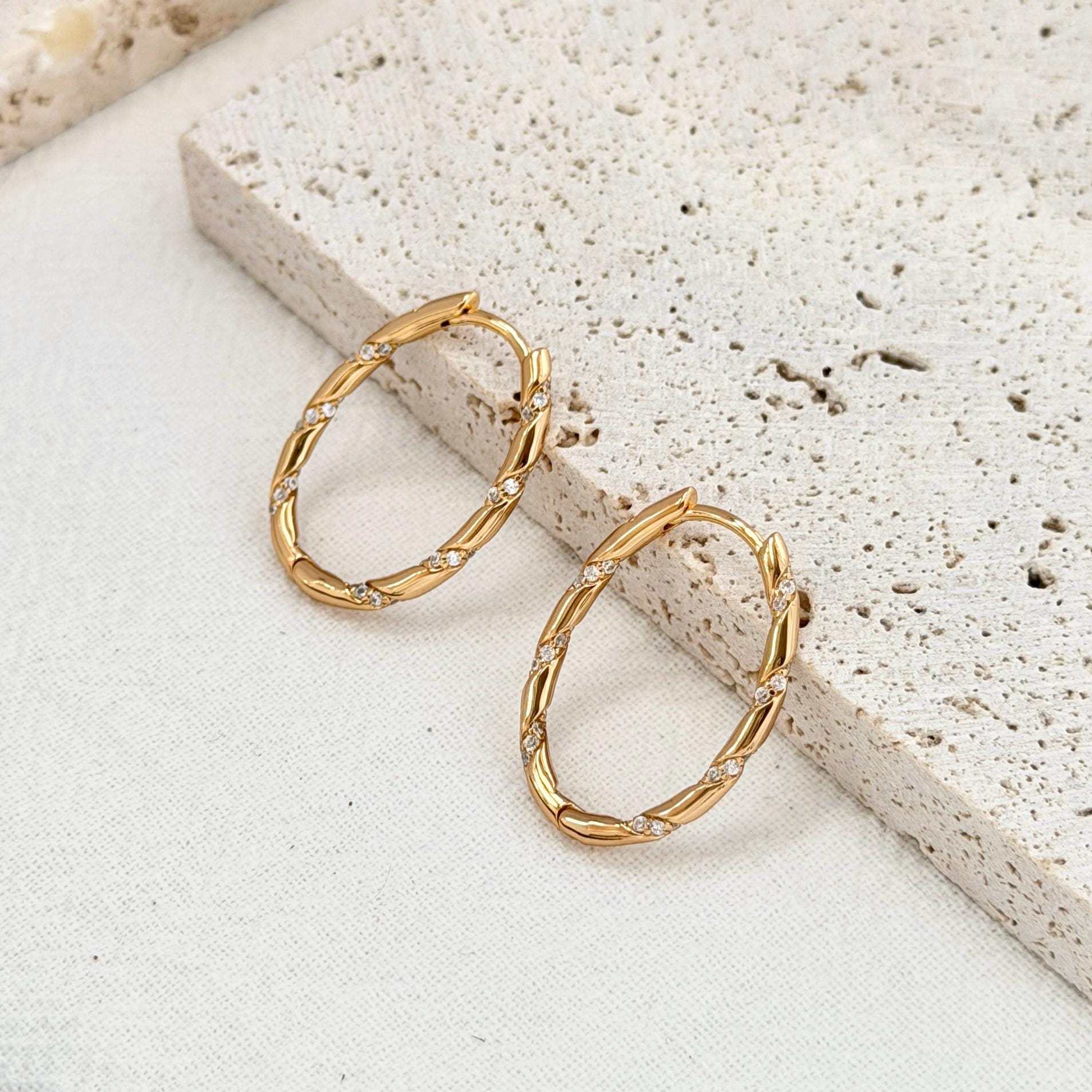 minimalist 18k gold hoop earrings with twisted rope texture and cz stones
