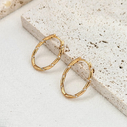 minimalist 18k gold hoop earrings with twisted rope texture and cz stones
