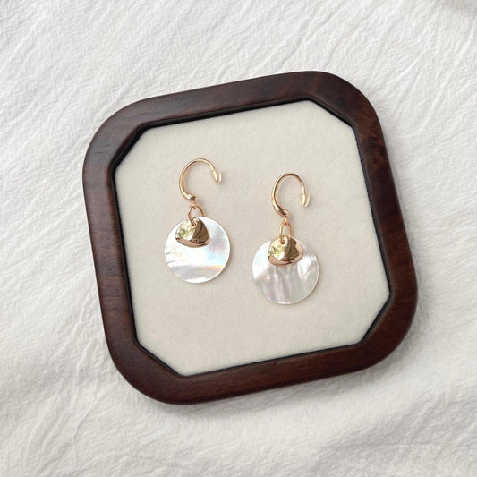 Side view of 18K gold mother-of-pearl hoop drop earrings