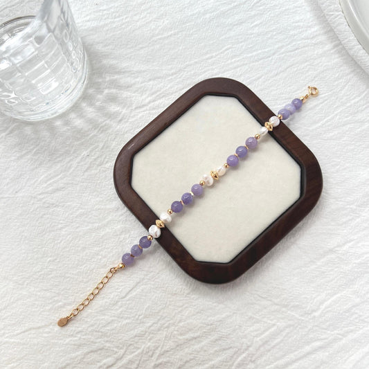 Side view of 18K gold baroque pearl and lepidolite gemstone bracelet