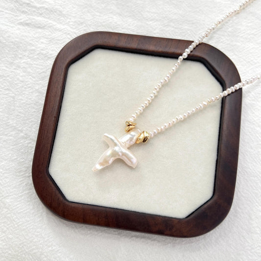 Handmade freshwater pearl cross pendant necklace with gold clasp, minimalist and elegant jewelry for women.