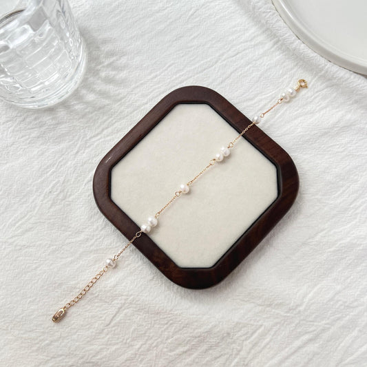 Side view of 18K gold baroque pearl beaded bracelet, delicate and dainty