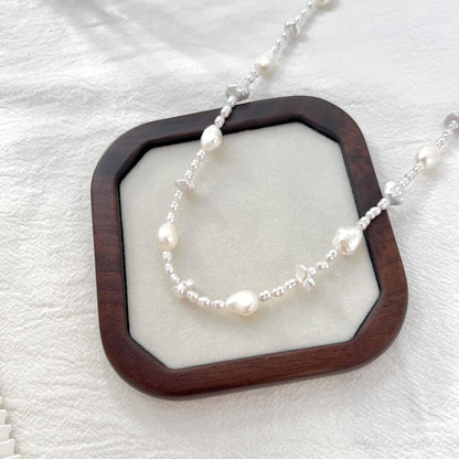 Close-up of freshwater baroque irregular pearl beaded necklace, highlighting unique irregular shapes and luster