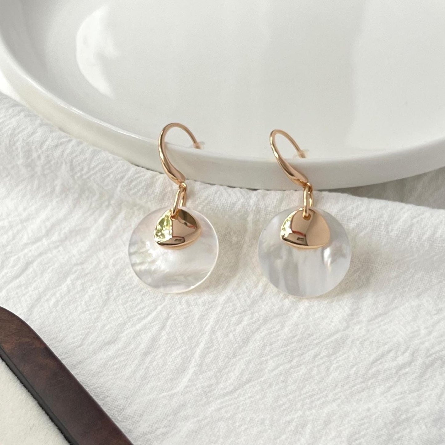 18k gold mother of pearl dangling earrings on ear minimalist chic

