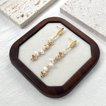 dainty baroque pearl dangle earrings with textured gold details, elegant minimalist jewelry for everyday wear