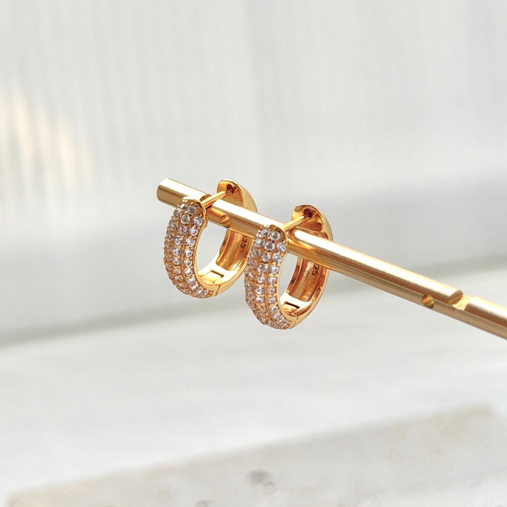 18k gold cz huggie hoop earrings on ear everyday chic accessory
