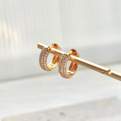 18k gold cz huggie hoop earrings on ear everyday chic accessory
