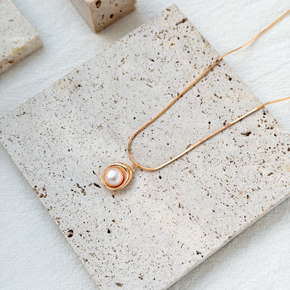 minimalist 18k gold freshwater pearl pendant necklace styled flatlay jewelry
