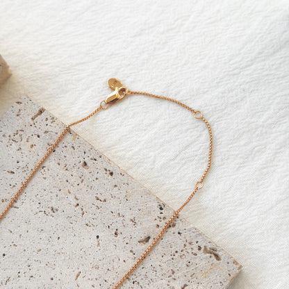 18k gold knot tassel pendant necklace on neck chic elegant style
