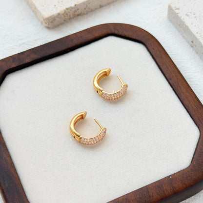 18k gold cz huggie hoop earrings on ear everyday chic accessory
