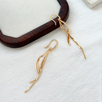 minimalist 18k gold tassel dangle earrings versatile stylish accessory
