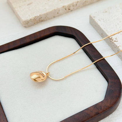minimalist 18k gold freshwater pearl pendant necklace styled flatlay jewelry
