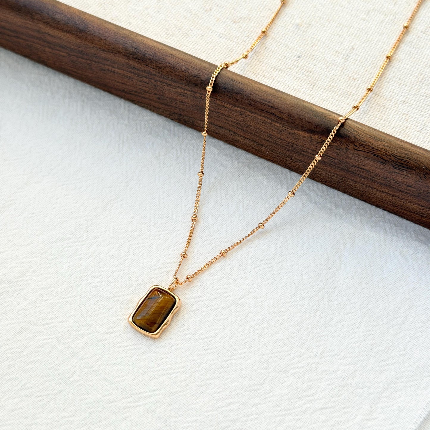 18k gold tigers eye pendant necklace on neck elegant earthy style
