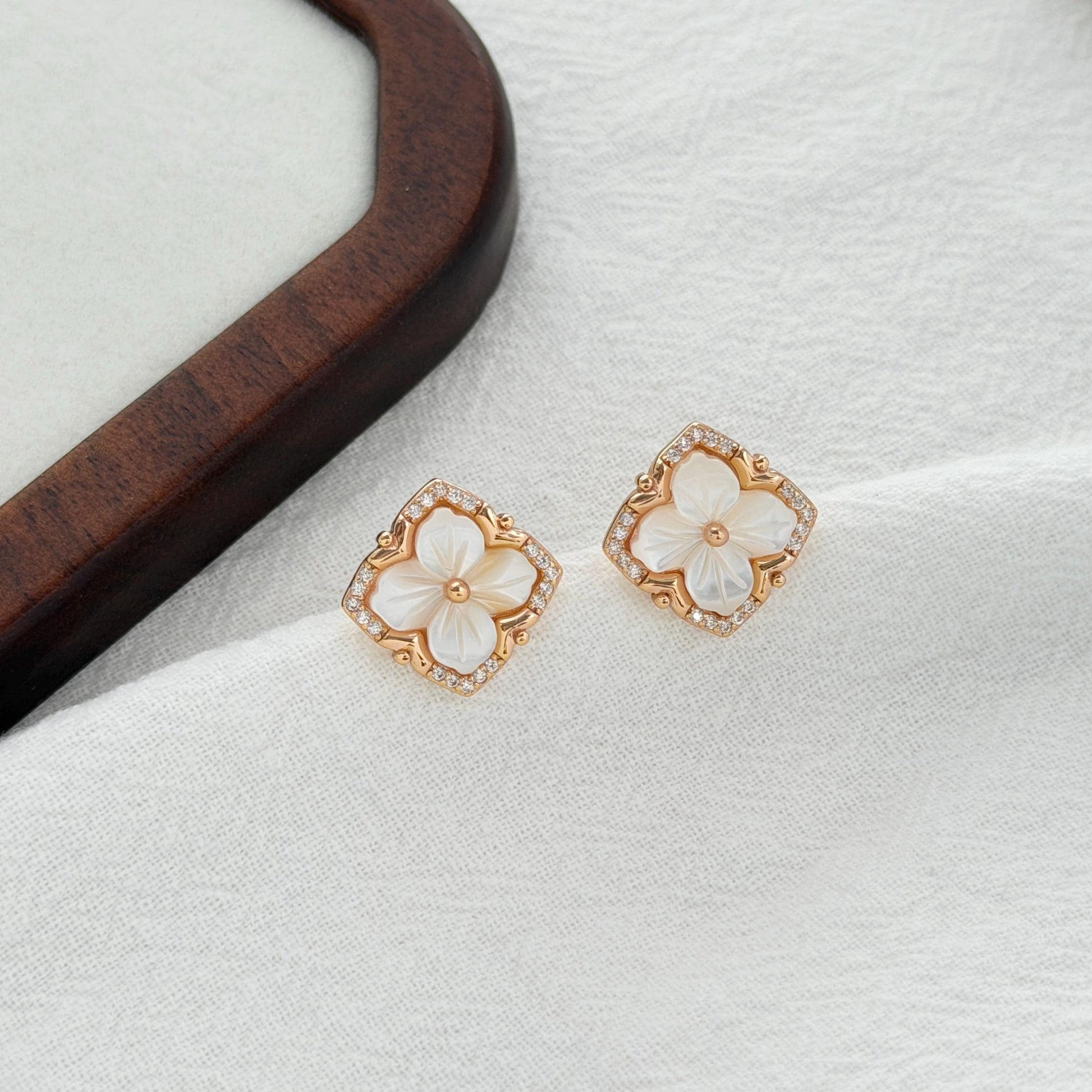 gold clover earrings with carved shell flower and cz detailing minimal elegant jewelry