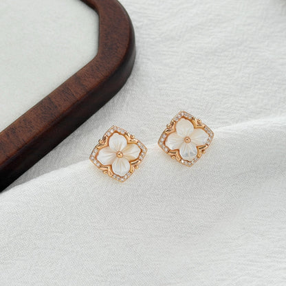 gold clover earrings with carved shell flower and cz detailing minimal elegant jewelry
