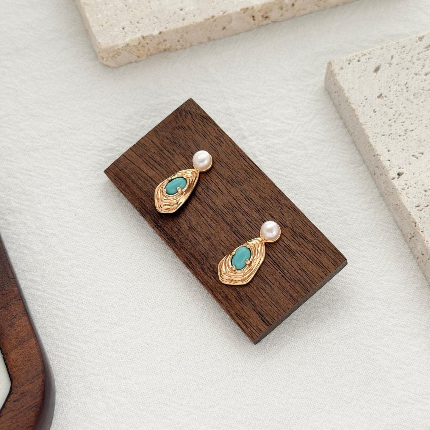 bold gold earrings with turquoise center and pearl stud modern statement jewelry