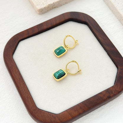Green malachite hoop earrings with rectangular stone pendants and textured gold hoop design