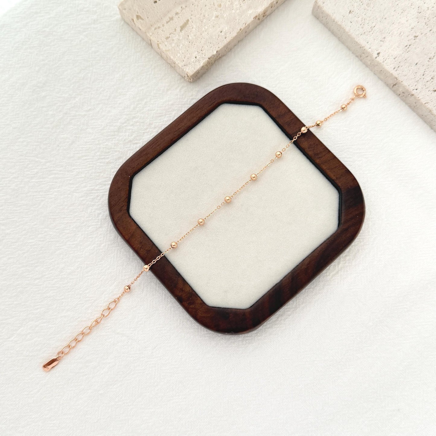 Gold stacking bracelet crafted in sterling silver with subtle beaded chain design