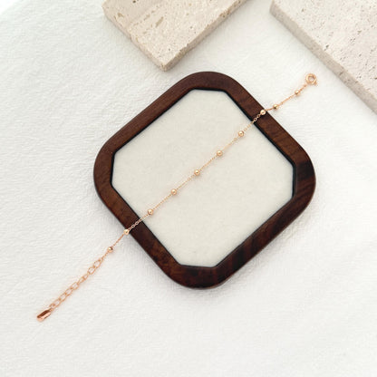 Gold stacking bracelet crafted in sterling silver with subtle beaded chain design