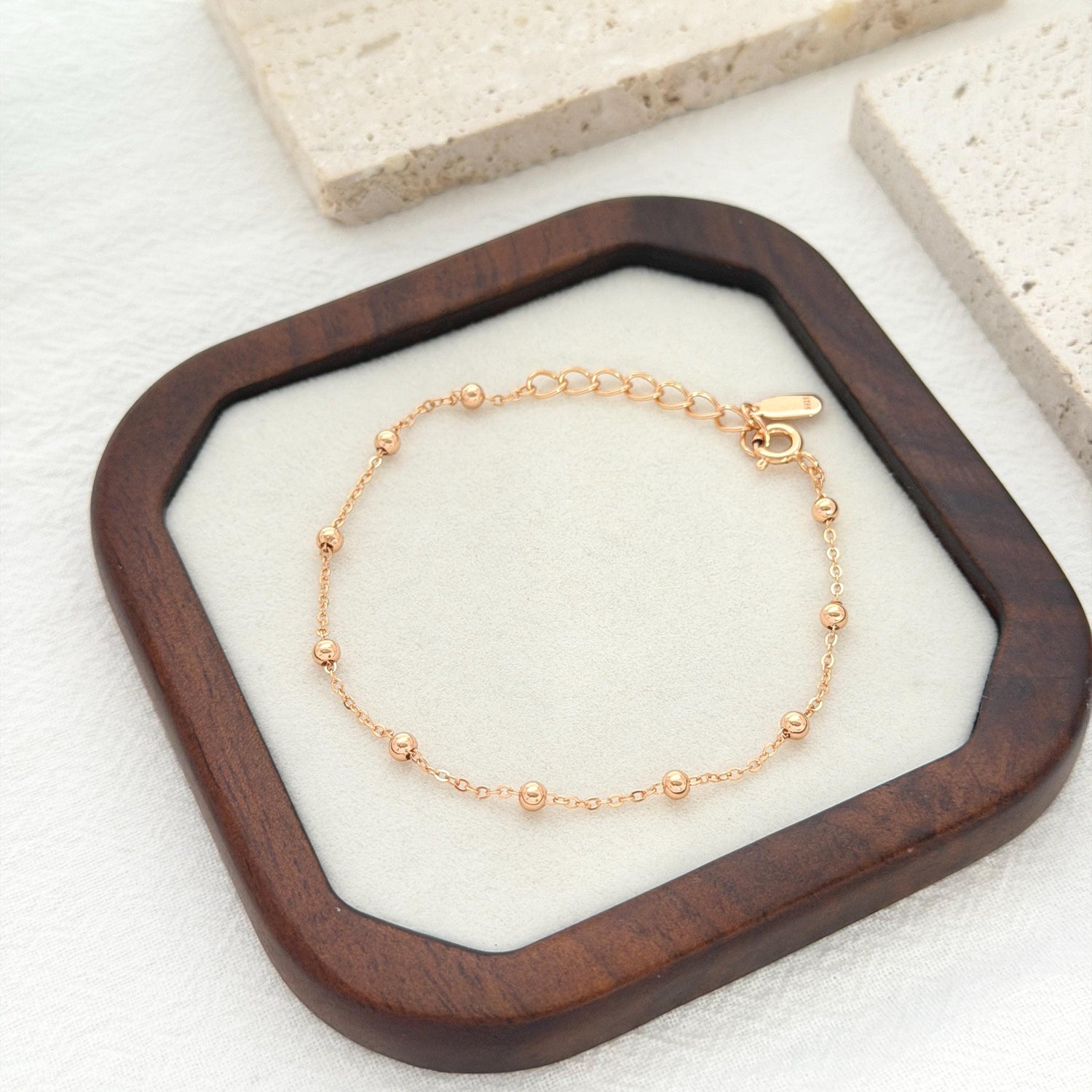 Dainty gold bead bracelet with delicate chain design perfect for layering and stacking