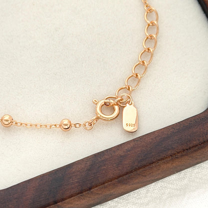 Delicate gold chain bracelet with tiny polished beads and minimalist modern feel