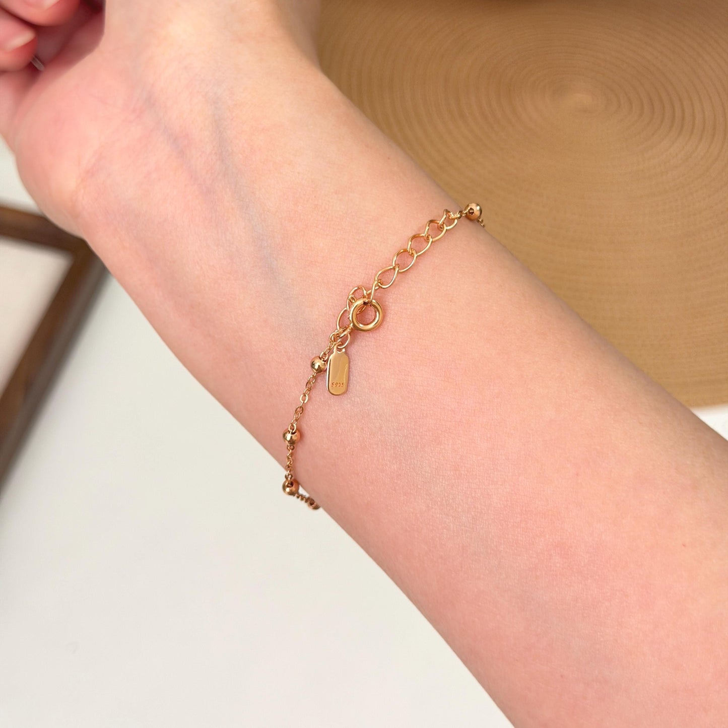 Layering bead bracelet in gold over sterling silver with simple elegant design 