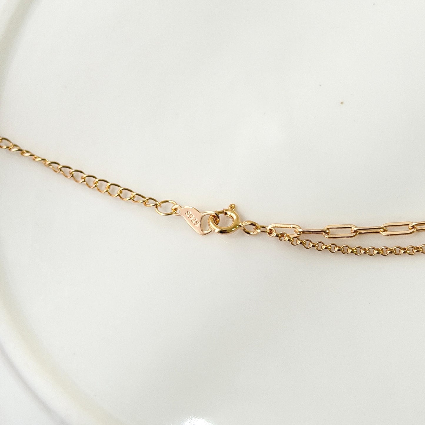 Everyday gold necklace with layered chains and refined minimalist aesthetic