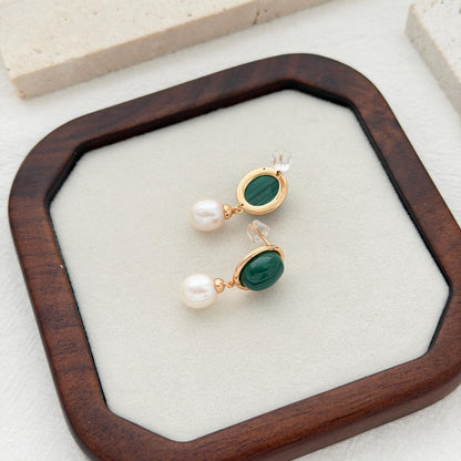 Vintage-inspired malachite pearl earrings with oval green gemstones and dangling freshwater pearls.