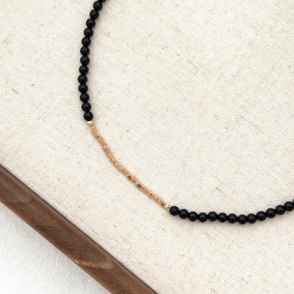 Minimal black necklace with small gemstone beads and gold finish