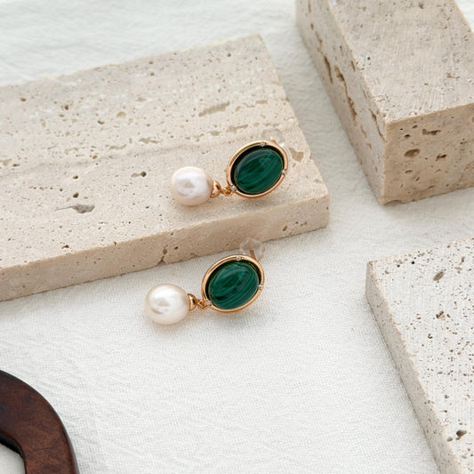 Vintage green malachite drop earrings with luminous freshwater pearls and warm gold settings.