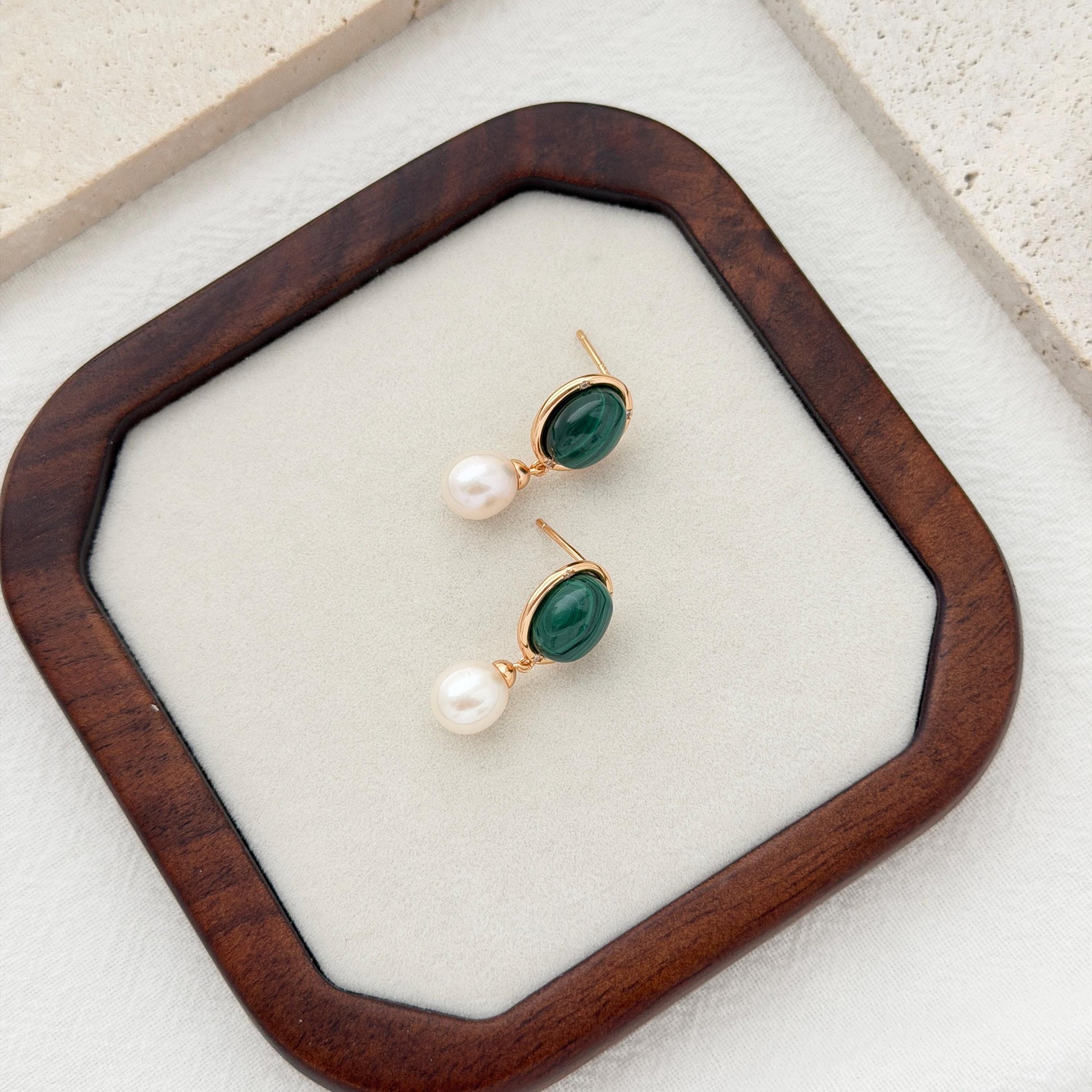 Green bridal drop earrings with malachite stones, white pearls, and subtle crystal accents.